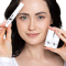 Girl holding brow glue in her right hand and Step 1 and 2 in her left